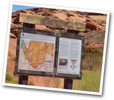a trail map and marker at the red cliffs desert reserve